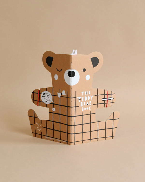 A creative pop-up card featuring The Teddy Bear Drawing Book in a box, with parts of the bear's body designed as the flaps of the box. The bear holds a red and black drawing book