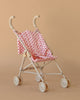 The Konges Sloejd Doll Stroller - Rosie Rose features a pink floral seat and white frame—compact, lightweight, and perfect for playtime adventures.