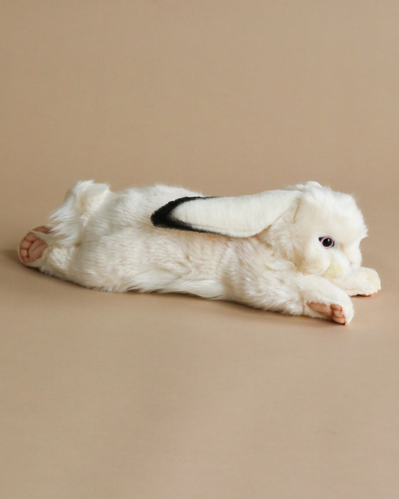 laying white bunny stuffed animal