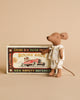 A Maileg Big Sister and Me Set mouse in patterned pajamas stands beside a vintage-style "Mouse Race" matchbox with a red race car illustration and decorative text on a beige background.