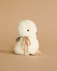 The Pre-order: Maileg Chicken Plush, Mini (ships in one week) features a white, fluffy mini chicken with an orange beak, brown eyes, and a twine bow at its neck, displayed on a plain beige background.