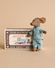 The Maileg Big Brother Family Room Set features a small mouse in blue striped pajamas beside a vintage-style "Mouse Race" matchbox, adding charm to any dollhouse collection.