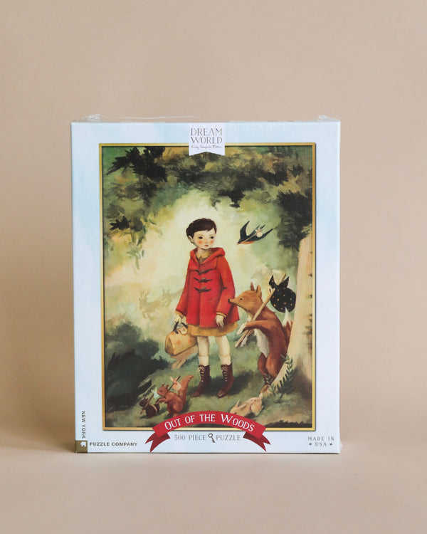 A Emily Winfield Martin, Out of the Woods Puzzle - 500 Piece featuring a whimsical illustration by Emily Winfield Martin of a child in a red coat with animals in a mystical forest. The puzzle, made in the USA.
