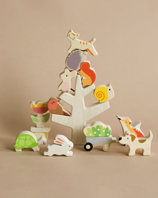 A collection of Stacking Garden Friends creatively arranged to form a stack, including a horse, cat, dog, turtle, rabbit, and duck, against a soft beige background.