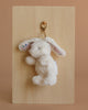 The Mon Ami Bunny Keychain / Bag Charm is a fluffy white bunny with floral-patterned inner ears and a gold clasp, perfect for hanging on your bag or keys. This soft plush accessory adds a cute touch to any collection.