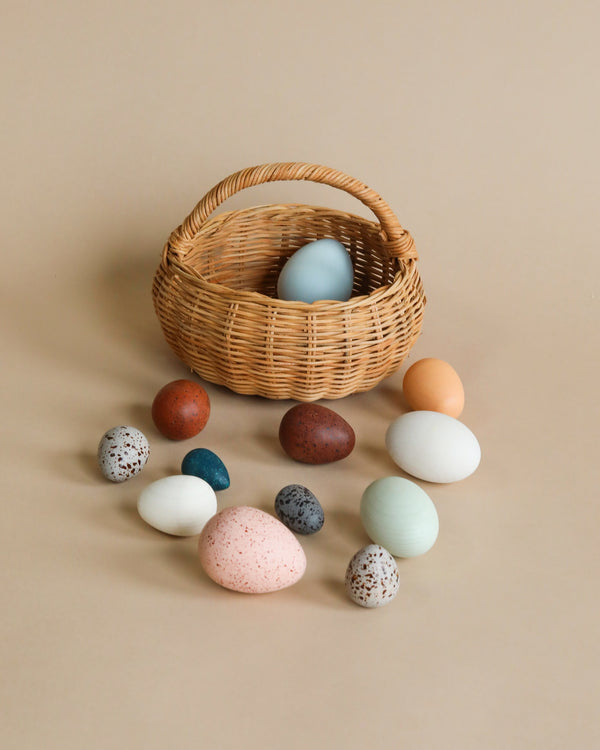 Wooden egg toys in a basket