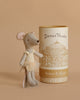 The Maileg Ballet Dancer Mouse, Big Sister, wearing a yellow ballet outfit, stands next to a cylindrical box labeled "Dance Theater Romeo & Juliet," which shows a theater illustration on a beige background.