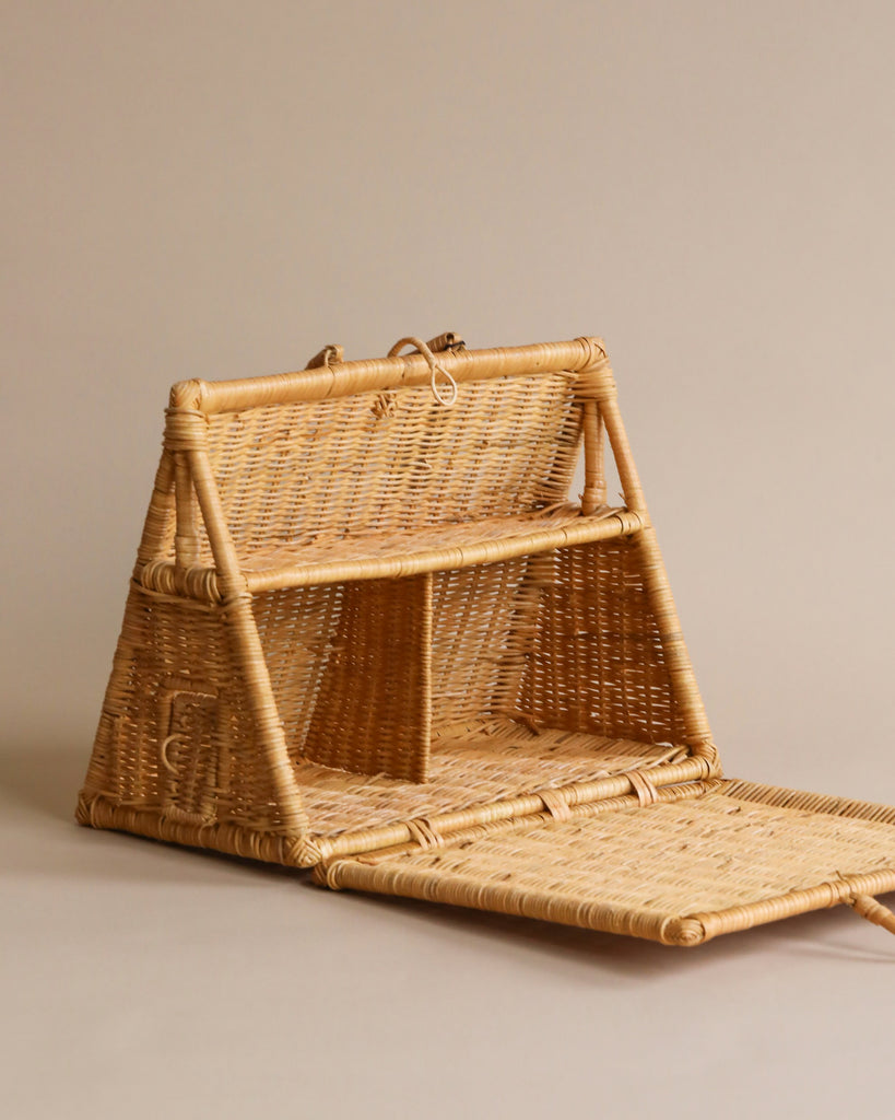 A traditional three-tiered braided A-Frame Dollhouse displayed against a neutral background, showcasing intricate weaving and smooth finishes.