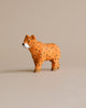 A Hand Carved Wooden Cheetah model, with a lifelike stance and detailed painting, ideal for kids' bedroom decor, positioned against a neutral beige background.