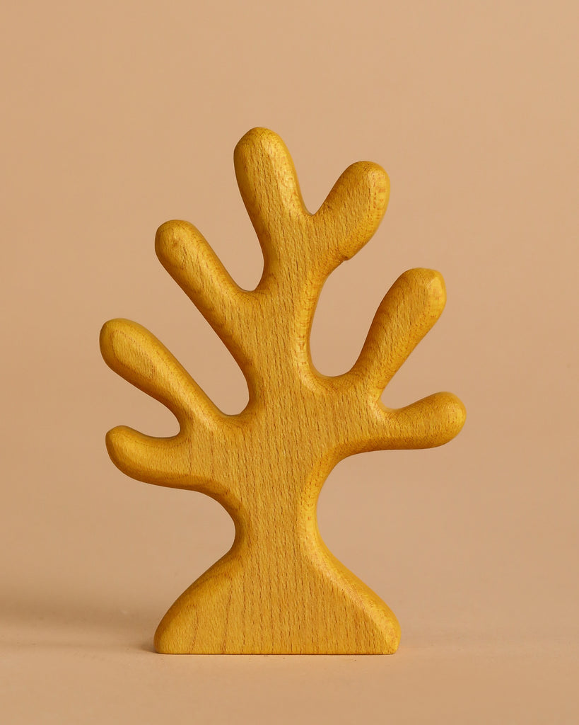 The Handmade Holzwald Underwater World Set features a warm yellow, stylized wooden sculpture with five rounded branches—ideal as an educational toy or to enrich your Holzwald toys collection.