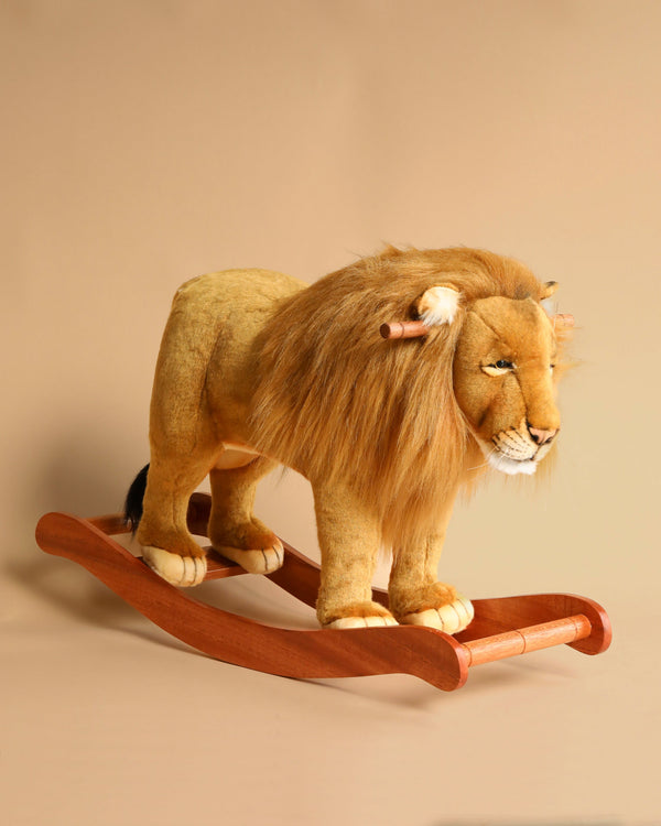 A handcrafted Stuffed Animal Lion Rocker with a realistic mane, mounted on a wooden rocking base, against a plain beige background.