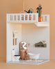 The Maileg Bonus Room Bathroom Set includes a mouse figurine, vanity, clawfoot tub, toilet, and crocheted wall hanging. Upstairs features House of Miniature accessories like a watering can and potted plant.