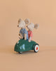 The Maileg Big Brother and Sister Adventure Set features two magnetic mice—one in a blue striped shirt, one in red—sitting together in a small green toy car against a plain beige background.