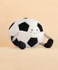 The Mon Ami - Sergio Soccer Ball - Large features a plush design with a smiling face, blushing cheeks, classic black and white patches, and striped legs with black feet. Sitting on a light beige background, it makes a perfect gift for soccer lovers.