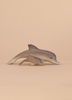 Two handcrafted toys from the Bumbu Handmade Wooden Dolphin Family Set, featuring an adult and calf dolphin, are displayed side by side on a light beige background to highlight their eco-friendly design.
