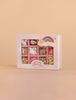The Konges Sloejd ABC Jewelry Set includes colorful letter, heart, pearl, and smiley face beads—ideal for any jewellery making kit. The pink box has a rainbow, clouds, and stars on a beige background.