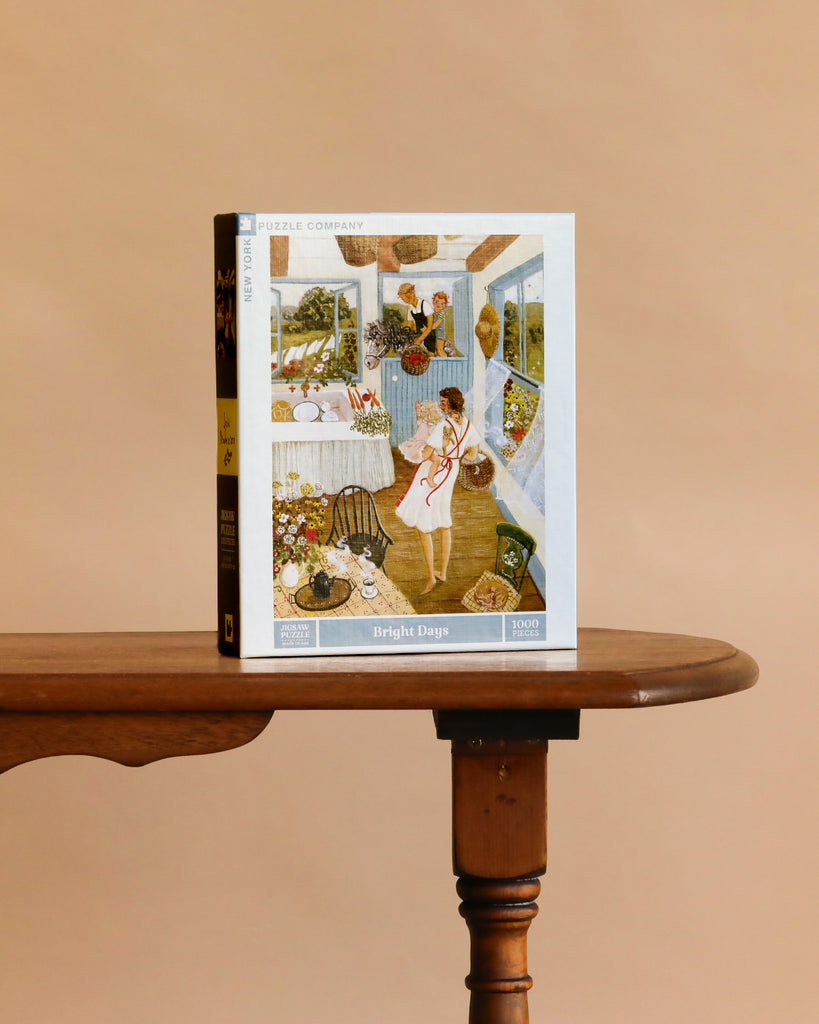 A Bright Days - 1000 Piece Jigsaw Puzzle box featuring a woman in a vibrant, cozy room stands upright on a wooden table with a plain beige background.
