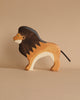 Part of the Holztiger Handmade Wooden Safari Animals Set, this handcrafted wooden toy lion features a dark brown mane, light brown body, and black tail on a neutral background—ideal for collectors and animal playsets.