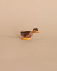 A small Ostheimer Long Neck Duck figurine with a brown body and blue accents, standing against a plain, light beige background.