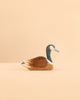 Handcrafted in Germany, the Ostheimer Canada Goose - Swimming is a wooden toy depicting a swimming Canada goose with a brown body and distinct black and white neck markings.