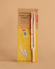 The Huckleberry Paper Plane Launcher is a birch wood set with a wooden stick and red elastic bands, designed for ages 3+, packaged with an image of a child launching a paper airplane and the phrase "LET'S GO OUTSIDE!.