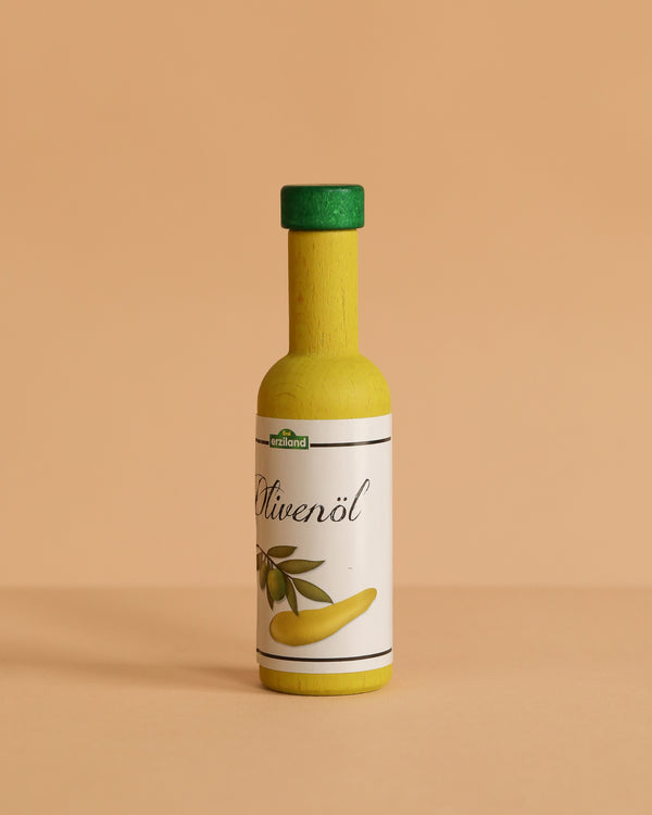 The Erzi Olive Oil Pretend Food is a small yellow play bottle with a green cap labeled "Olivenöl" and an olive illustration, perfect for any pretend kitchen toy set, shown against a plain beige background.