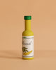 The Erzi Olive Oil Pretend Food is a small yellow play bottle with a green cap labeled "Olivenöl" and an olive illustration, perfect for any pretend kitchen toy set, shown against a plain beige background.