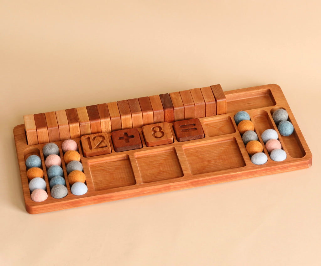 A The Original Extended Math Board - Made in USA with sliding covers, consisting of colorful felt balls and engraved numbers and math symbols for learning basic arithmetic.