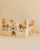 Wooden castle toy with gem inserts
