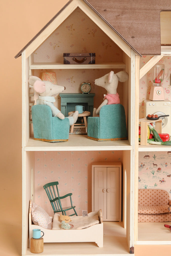 The Maileg Fully Furnished Farmhouse Set + Surprise Gift (ships in 1 week) includes charming pastel accessories and furniture for toy mice, from a cozy bedroom with bed and wardrobe to relaxing living spaces—perfect for your miniature dollhouse.