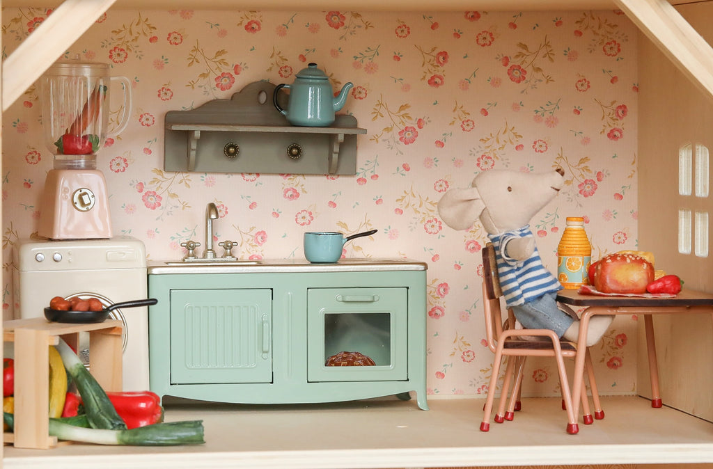 Create a cozy miniature kitchen with the Maileg Fully Furnished Farmhouse Set + Surprise Gift (ships in 1 week), featuring mouse dolls, pastel appliances, veggies, and accessories—perfect for your Maileg Farmhouse Dollhouse.