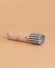 The Konges Sloejd Kaleidoscope - Rock My Boat features a pastel pink FSC-certified body with small animal illustrations and a blue-and-white striped viewing end, displayed on a light peach background.