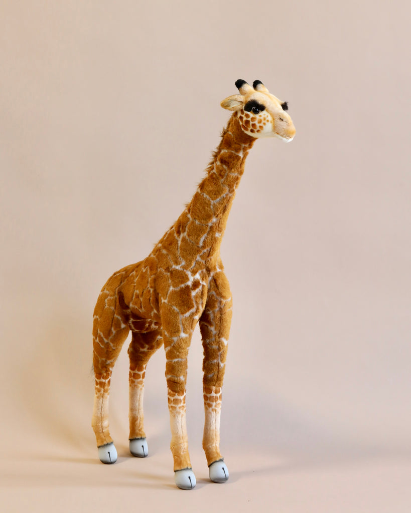 A hand-sewn Medium Giraffe Stuffed Animal, 34'' standing.