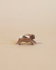 A handcrafted Ostheimer Rabbit - Running keychain with a metallic ring, set against a light beige background.
