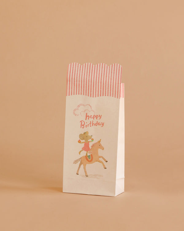 The Maileg Goodie Bags - Happy Birthday - Unicorn (12 Pieces) feature a white design with red stripes, a unicorn illustration, and "Happy Birthday" in pink—making them a delightful addition to any celebration.