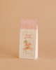 The Maileg Goodie Bags - Happy Birthday - Unicorn (12 Pieces) feature a white design with red stripes, a unicorn illustration, and "Happy Birthday" in pink—making them a delightful addition to any celebration.