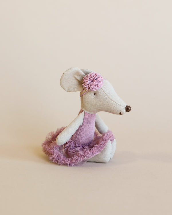 A Maileg Ballerina Mouse - Big Sister (Heather) dressed in a delicate pink tutu and a matching floral headband, sitting against a plain light beige background.
