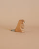 The Ostheimer Beaver - Sitting is a handcrafted wooden toy portraying a brown beaver with a flat, gray tail on a plain beige background. The figurine is seated upright with its mouth slightly open, exuding a simplistic and natural charm reminiscent of Ostheimer craftsmanship. Made from sustainable materials, this piece captures the timeless appeal of Ostheimer wooden toys.