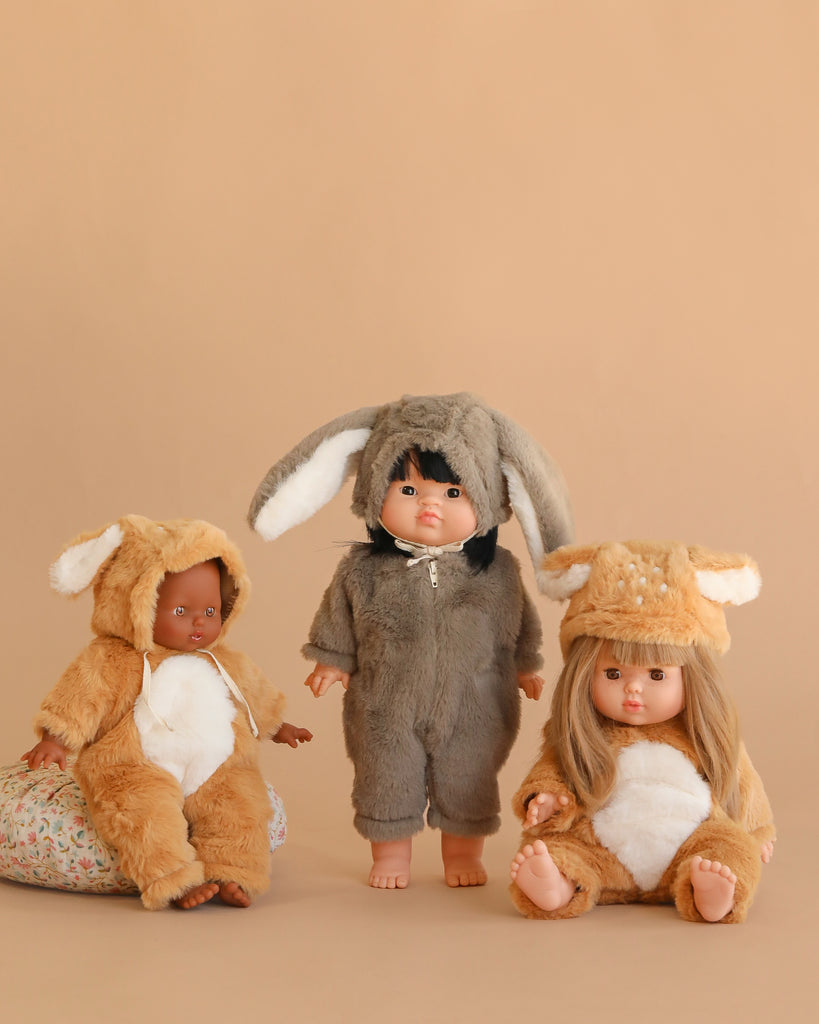 Three 13" Minikane dolls dressed in Bambi Costume outfits pose against a beige background. Each doll wears the Minikane 13" Doll Clothing | Bambi Costume, crafted in France.