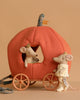 The Maileg Royal Pumpkin Carriage Set features two crown-wearing mice posed with a plush pumpkin carriage—one mouse inside, one outside—all set against a simple light brown background.