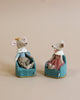 Two Maileg Royal Mice, King Mouse and a fox, dressed in royal outfits and sitting in turquoise chairs against a beige background. King Mouse wears a crown and the fox wears