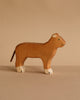 The Holztiger Handmade Wooden Safari Animals Set features a handcrafted wooden lioness with painted green eyes, black nose, and white feet—ideal for imaginative play or adding to any Holztiger collection.