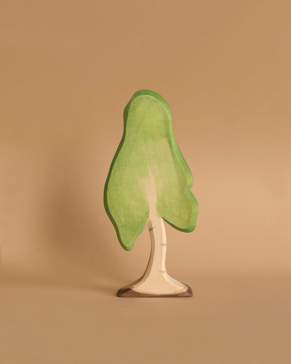 A large wooden birch tree with a light green canopy and a beige trunk. The Ostheimer Birch Tree, perfect for imaginative play, has a simplified and slightly whimsical design, standing upright against a plain white background.