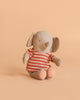 Maileg Little Jumbo the Elephant is a small, soft linen-viscose toy with large ears and a red and beige striped shirt, shown sitting upright against a peach-colored background.