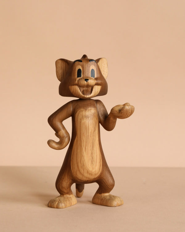 The Boyhood Tom & Jerry X Tom, Small is a solid oak figurine of Tom the cat, smiling with one hand on his hip and the other paw raised, displayed against a beige background.