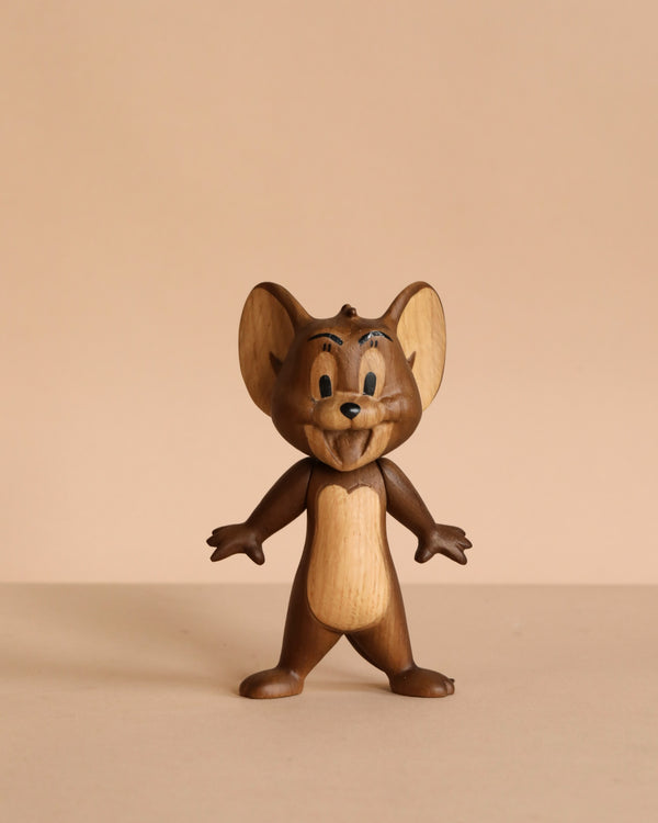 The Boyhood Tom & Jerry - Jerry is a solid oak figurine of Jerry mouse, standing upright with arms slightly outstretched on a plain beige background.