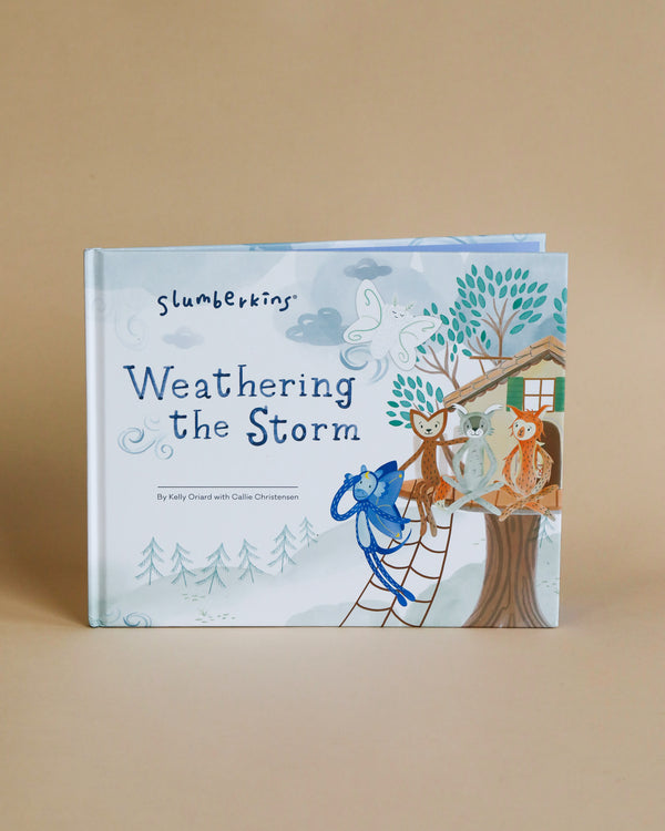 A Slumberkins Weathering the Storm Book emphasizing resilience, featuring illustrated animals (owl, rabbit, and bear) on the cover, set against a backdrop of trees and clouds