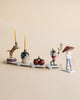 The Magical Forest Birthday Train With Beeswax Candles features four connected carts—a tiger with candles, a rabbit, cherries, a mouse with party hat and stick, and a mushroom-capped figure—perfect for your birthday celebration.