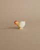 From the Enchanted Woodland Farm Set, a small painted wooden chicken with a red comb and yellow beak stands on a beige background, crafted in the charming style of handmade Ostheimer-like toys.
