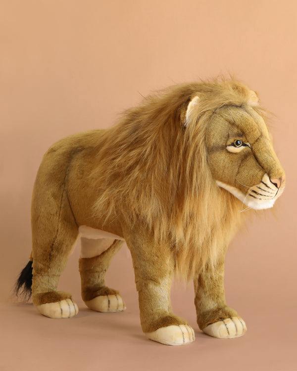 The Ride-On Lion - Final Sale from HANSA features a realistic design with a thick mane, detailed face, and soft, hand-sewn plush. This lifelike lion stands on all fours against a beige background, perfect for imaginative play.